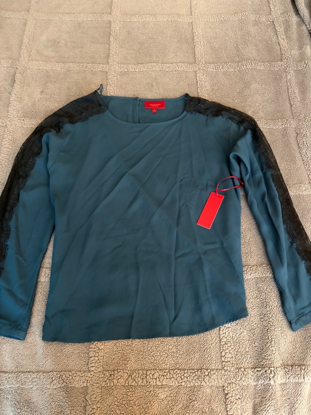 Jennifer Lopez Teal Blouse with Black Lace Trim